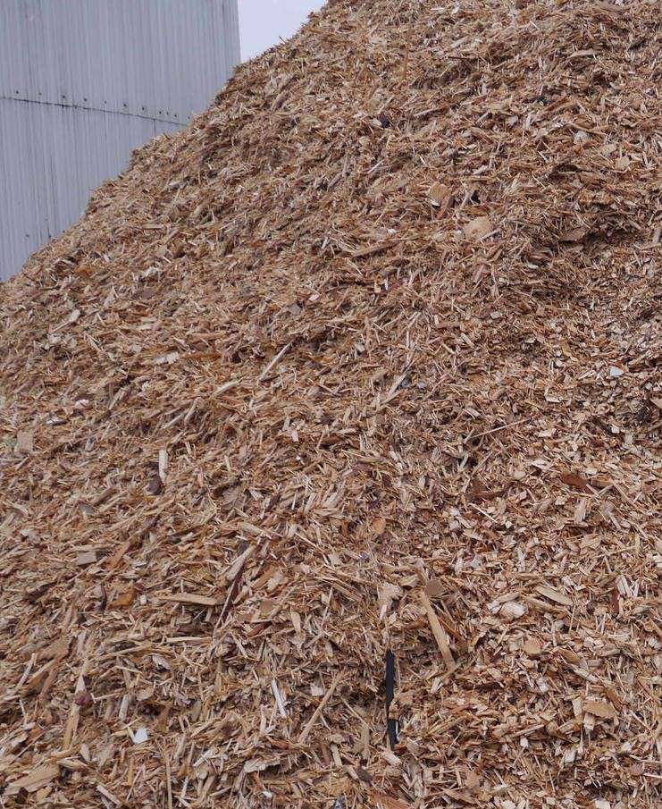 Yard stacked with prepared biomass wood chips